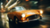 Reifegradanalyse für einen Automobilhersteller, ein orange-farbener Honda S600 fahrend, nachts, in einer verregneten Stadt
